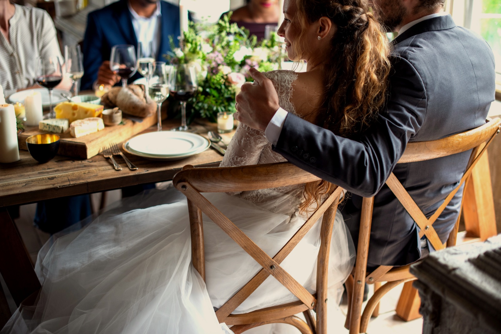 Elegant wedding table setting with candles and florals