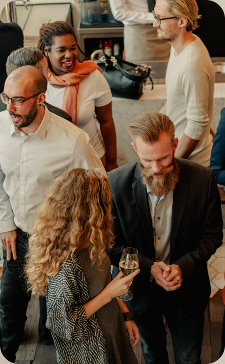 Colleagues sharing a drink and conversation at a networking event